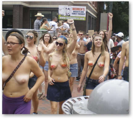 Thousands join GoTopless protest in Asheville, NC.